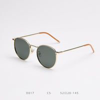 gold frame green lens